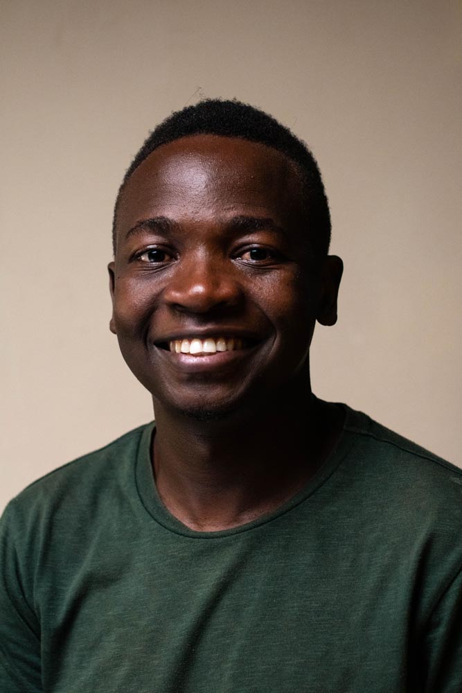 Model wearing women's black cotton crewneck tee.